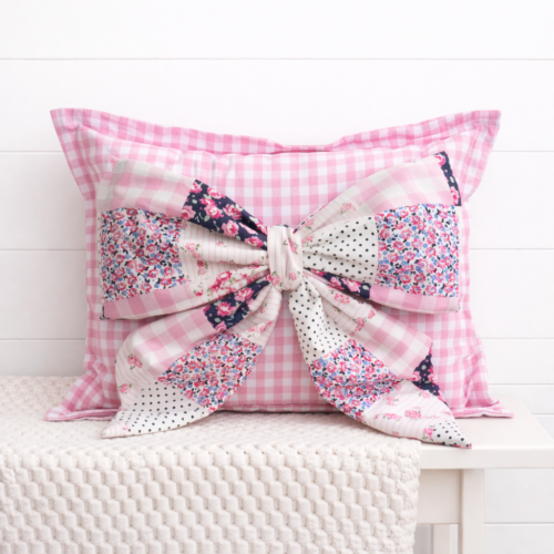 Pink Patchwork Snap-It bow attached to pink gingham Snap-It pillow